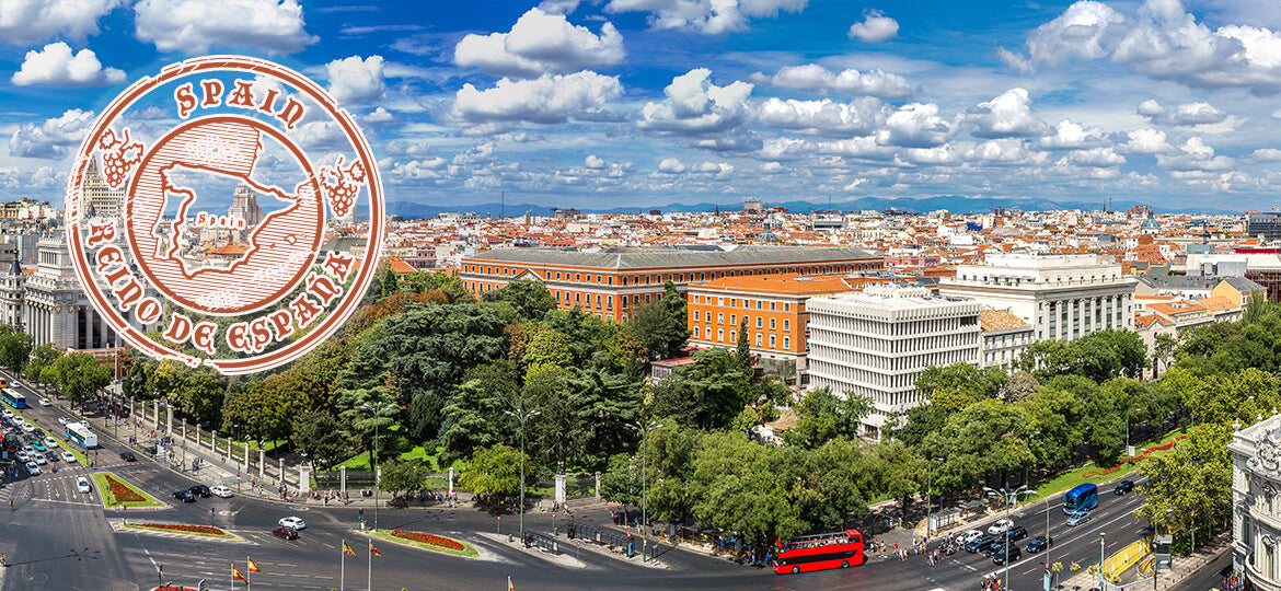 Cityscape of Madrid with a large stamp overlay on the left side.