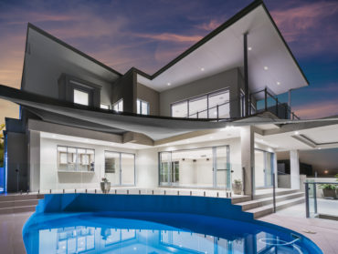 Modern house with a pool at dusk