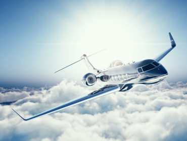 Helicopter flying above the clouds