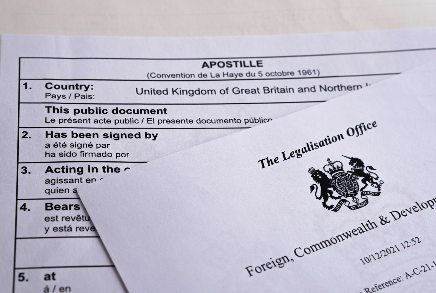 Apostille document and envelope from The Legalisation Office on a light background