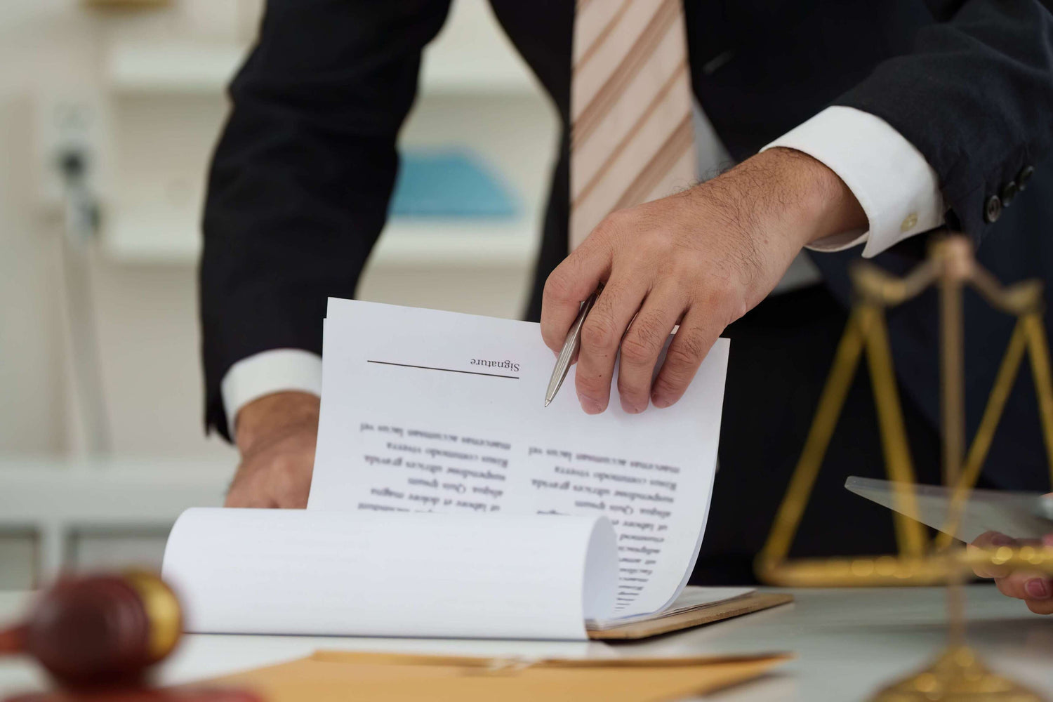 Lawyer holding a document with a scale in the background, symbolizing justice.