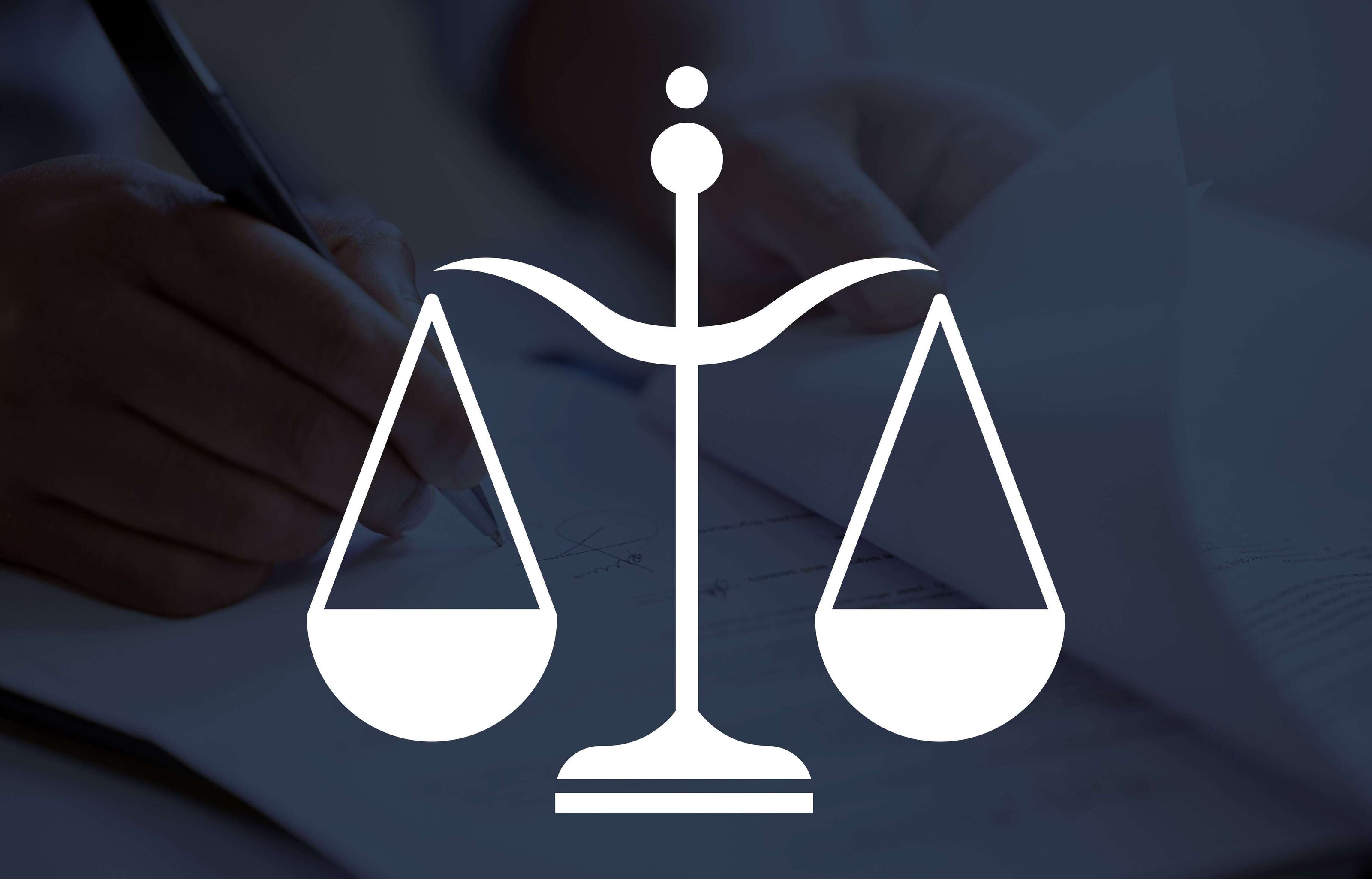 White balance scale icon on a blurred background with a person writing.