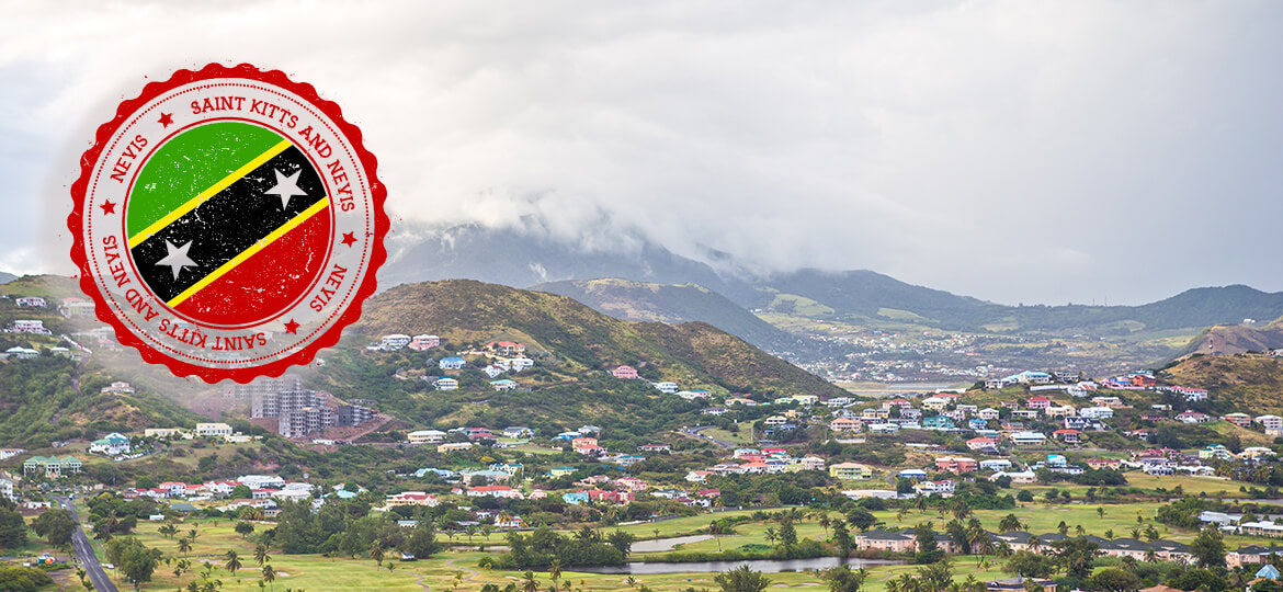 Village with mountains in the background, featuring the flag of Saint Kitts and Nevis.