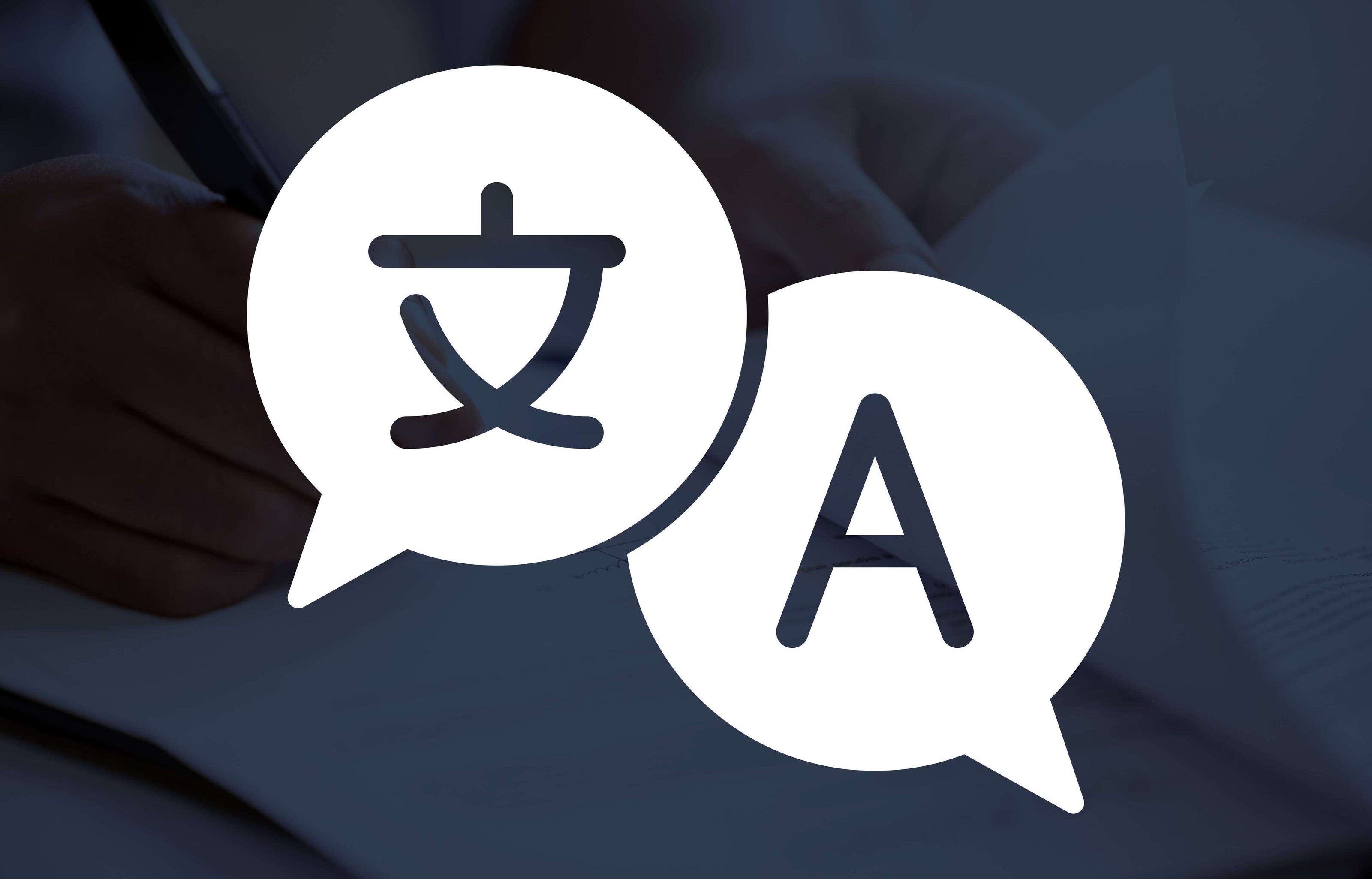 Two speech bubbles with Chinese characters and the letter 'A' on a blurred background.
